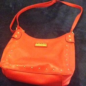 Nicole red bag.